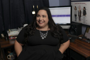 Voice artist Maria Pendolino sitting on her desk