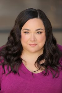 Professional award-winning Medical Narrator, voice actor Maria Pendolino, wearing a purple shirt.